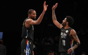 BROOKLYN, NY - APRIL 7: Kevin Durant #7 and Kyrie Irving #11 of the Brooklyn Nets high five during the game against the New Orleans Pelicans on April 7, 2021 at Barclays Center in Brooklyn, New York. NOTE TO USER: User expressly acknowledges and agrees that, by downloading and or using this Photograph, user is consenting to the terms and conditions of the Getty Images License Agreement. Mandatory Copyright Notice: Copyright 2021 NBAE (Photo by Nathaniel S. Butler/NBAE via Getty Images)