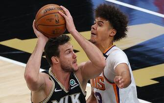 1316536708 ATLANTA, GEORGIA - MAY 05: Danilo Gallinari #8 of the Atlanta Hawks attacks the basket against Cameron Johnson #23 of the Phoenix Suns at State Farm Arena on May 05, 2021 in Atlanta, Georgia. NOTE TO USER: User expressly acknowledges and agrees that, by downloading and or using this photograph, User is consenting to the terms and conditions of the Getty Images License Agreement. (Photo by Kevin C. Cox/Getty Images)