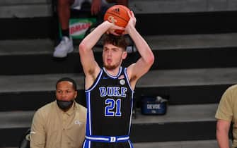 ATLANTA, GA  MARCH 02:  Duke forward Matthew Hurt (21) shoots a three point shot during the NCAA basketball game between the Duke Blue Devils and the Georgia Tech Yellow Jackets on March 2nd, 2021 at Hank McCamish Pavilion in Atlanta, GA.  (Photo by Rich von Biberstein/Icon Sportswire via Getty Images)
