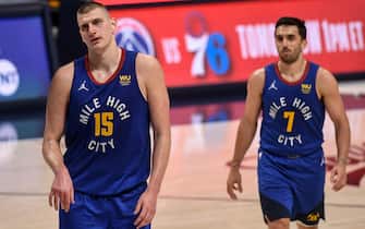 1319552618 DENVER, CO - MAY 22: Nikola Jokic (15) of the Denver Nuggets and Facundo Campazzo (7) walk off the court after the fourth quarter of the Portland Trail Blazers"u2019 123-109 win at Ball Arena on Saturday, May 22, 2021. (Photo by AAron Ontiveroz/The Denver Post)