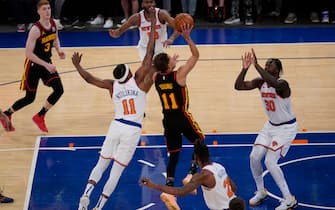NEW YORK, NY - MAY 23: Atlanta Hawks' Trae Young (11) hits the go-ahead basket near the end of Game 1 of an NBA basketball first-round playoff series against the New York Knicks on May 23, 2021 in New York City. The Hawks defeated the Knicks 107-105. NOTE TO USER: User expressly acknowledges and agrees that,  by downloading and or using this photograph,  User is consenting to the terms and conditions of the Getty Images License Agreement. (Photo by Seth Wenig - Pool/Getty Images)
