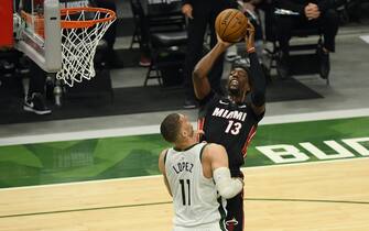 1319877786 MILWAUKEE, WISCONSIN - MAY 24: Bam Adebayo #13 of the Miami Heat shoots against Brook Lopez #11 of the Milwaukee Bucks in the first quarter during Game Two of their Eastern Conference first-round playoff series between the Milwaukee Bucks and the Miami Heat at Fiserv Forum on May 24, 2021 in Milwaukee, Wisconsin. NOTE TO USER: User expressly acknowledges and agrees that, by downloading and or using this photograph, User is consenting to the terms and conditions of the Getty Images License Agreement. (Photo by Quinn Harris/Getty Images)