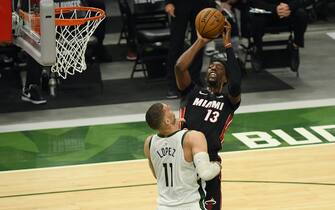 MILWAUKEE, WISCONSIN - MAY 24:  Bam Adebayo #13 of the Miami Heat shoots against Brook Lopez #11 of the Milwaukee Bucks in the first quarter during Game Two of their Eastern Conference first-round playoff series between the Milwaukee Bucks and the Miami Heat at Fiserv Forum on May 24, 2021 in Milwaukee, Wisconsin.  NOTE TO USER: User expressly acknowledges and agrees that, by downloading and or using this photograph, User is consenting to the terms and conditions of the Getty Images License Agreement. (Photo by Quinn Harris/Getty Images)