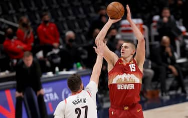 DENVER, COLORADO - MAY 24: Nikola Jokic #15 of the Denver Nuggets puts up a shot over Jusuf Nurkic #27 of the Portland Trail Blazers in the second quarter during Game Two of their Western Conference first-round playoff series at Ball Arena on May 24, 2021 in Denver, Colorado. NOTE TO USER: User expressly acknowledges and agrees that, by downloading and or using this photograph, User is consenting to the terms and conditions of the Getty Images License Agreement. (Photo by Matthew Stockman/Getty Images)