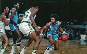 BOSTON - 1976:  Randy Smith #9 of the Buffalo Braves makes a move against Paul Silas #35 of the Boston Celtics during a game played in 1976 at the Boston Garden in Boston, Massachusetts. NOTE TO USER: User expressly acknowledges and agrees that, by downloading and or using this photograph, User is consenting to the terms and conditions of the Getty Images License Agreement. Mandatory Copyright Notice: Copyright 1976 NBAE (Photo by Dick Raphael/NBAE via Getty Images)