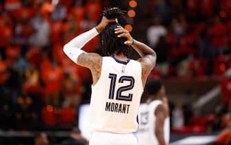 SALT LAKE CITY, UT - MAY 26: Ja Morant #12 of the Memphis Grizzlies fixes his hair before the game against the Utah Jazz during Round 1, Game 2 of the 2021 NBA Playoffs on May 26, 2021 at vivint.SmartHome Arena in Salt Lake City, Utah. NOTE TO USER: User expressly acknowledges and agrees that, by downloading and or using this Photograph, User is consenting to the terms and conditions of the Getty Images License Agreement. Mandatory Copyright Notice: Copyright 2021 NBAE (Photo by Jeff Swinger/NBAE via Getty Images)