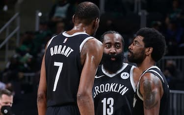 BOSTON, MA - MAY 30: James Harden #13 talks with Kevin Durant #7 and Kyrie Irving #11 of the Brooklyn Nets during the game against the Boston Celtics during Round 1, Game 4 of the 2021 NBA Playoffs on May 30, 2021 at the TD Garden in Boston, Massachusetts.  NOTE TO USER: User expressly acknowledges and agrees that, by downloading and or using this photograph, User is consenting to the terms and conditions of the Getty Images License Agreement. Mandatory Copyright Notice: Copyright 2021 NBAE  (Photo by Nathaniel S. Butler/NBAE via Getty Images)
