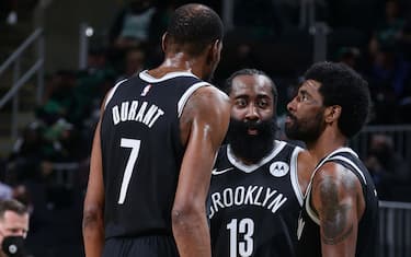 BOSTON, MA - MAY 30: James Harden #13 talks with Kevin Durant #7 and Kyrie Irving #11 of the Brooklyn Nets during the game against the Boston Celtics during Round 1, Game 4 of the 2021 NBA Playoffs on May 30, 2021 at the TD Garden in Boston, Massachusetts.  NOTE TO USER: User expressly acknowledges and agrees that, by downloading and or using this photograph, User is consenting to the terms and conditions of the Getty Images License Agreement. Mandatory Copyright Notice: Copyright 2021 NBAE  (Photo by Nathaniel S. Butler/NBAE via Getty Images)