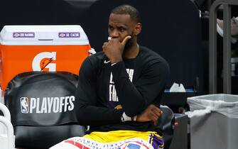 PHOENIX, ARIZONA - JUNE 01:  LeBron James #23 of the Los Angeles Lakers reacts on the bench during the second half in Game Five of the Western Conference first-round playoff series at Phoenix Suns Arena on June 01, 2021 in Phoenix, Arizona. NOTE TO USER: User expressly acknowledges and agrees that, by downloading and or using this photograph, User is consenting to the terms and conditions of the Getty Images License Agreement.  (Photo by Christian Petersen/Getty Images)