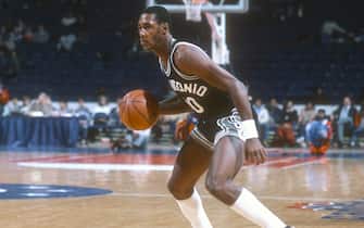 LANDOVER, MD - CIRCA 1983: Johnny Moore #00 of the San Antonio Spurs dribbles the ball against the Washington Bullets during an NBA basketball game circa 1983 at the Capital Centre in Landover, Maryland. (Photo by Focus on Sport/Getty Images) *** Local Caption *** Johnny Moore