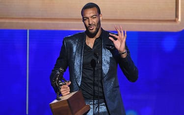 SANTA MONICA, CALIFORNIA - JUNE 24: Rudy Gobert accepts the Kia NBA Defensive Player of the Year award onstage during the 2019 NBA Awards presented by Kia on TNT at Barker Hangar on June 24, 2019 in Santa Monica, California. (Photo by Kevin Winter/Getty Images for Turner Sports)