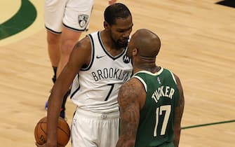 MILWAUKEE, WISCONSIN - JUNE 10: Kevin Durant #7 of the Brooklyn Nets and P.J. Tucker #17 of the Milwaukee Bucks exchange words during the second half of Game Three of the Eastern Conference second round playoff series at the Fiserv Forum on June 10, 2021 in Milwaukee, Wisconsin. NOTE TO USER: User expressly acknowledges and agrees that, by downloading and or using this photograph, User is consenting to the terms and conditions of the Getty Images License Agreement. (Photo by Stacy Revere/Getty Images)