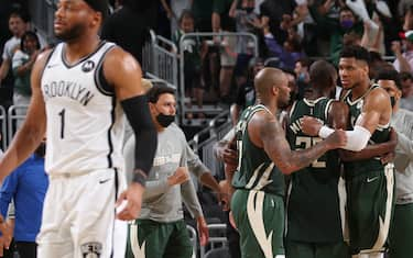 MILWAUKEE, WI - JUNE 10: The Milwaukee Bucks celebrate after winning Round 2, Game 3 of the 2021 NBA Playoffs against the Brooklyn Nets on June 10, 2021 at the Fiserv Forum Center in Milwaukee, Wisconsin. NOTE TO USER: User expressly acknowledges and agrees that, by downloading and or using this Photograph, user is consenting to the terms and conditions of the Getty Images License Agreement. Mandatory Copyright Notice: Copyright 2021 NBAE (Photo by Gary Dineen/NBAE via Getty Images).