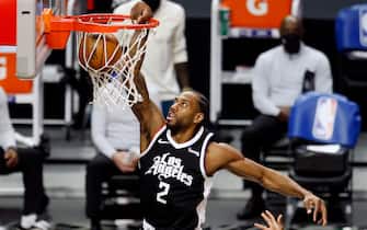 1232126431 LOS ANGELES, CA - APRIL 04: LA Clippers forward Kawhi Leonard (2) slam dunks the ball against the Los Angeles Lakers in the first quarter at the Staples Center on Sunday, April 4, 2021 in Los Angeles, CA. (Gary Coronado / Los Angeles Times)