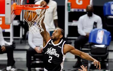 LOS ANGELES, CA - APRIL 04: LA Clippers forward Kawhi Leonard (2) slam dunks the ball against the Los Angeles Lakers in the first quarter at the Staples Center on Sunday, April 4, 2021 in Los Angeles, CA. (Gary Coronado / Los Angeles Times)