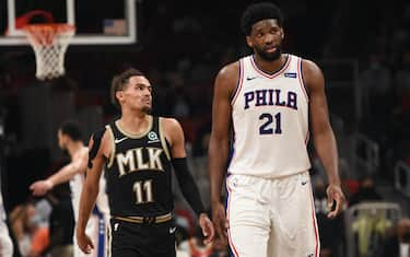 ATLANTA, GA - JUNE 14: Trae Young #11 of the Atlanta Hawks and Joel Embiid #21 of the Philadelphia 76ers talk  during Round 2, Game 4 of the Eastern Conference Playoffs on June 14, 2021 at State Farm Arena in Atlanta, Georgia. NOTE TO USER: User expressly acknowledges and agrees that, by downloading and/or using this Photograph, user is consenting to the terms and conditions of the Getty Images License Agreement. Mandatory Copyright Notice: Copyright 2021 NBAE (Photo by David Dow/NBAE via Getty Images) 