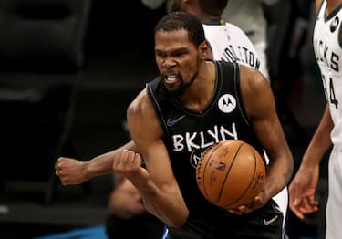 NEW YORK, NEW YORK - JUNE 15: Kevin Durant #7 of the Brooklyn Nets celebrates after he is fouled late in the fourth quarter against the Milwaukee Bucks during game 5 of the Eastern Conference second round at Barclays Center on June 15, 2021 in the Brooklyn borough of New York City. NOTE TO USER: User expressly acknowledges and agrees that, by downloading and or using this photograph, User is consenting to the terms and conditions of the Getty Images License Agreement. (Photo by Elsa/Getty Images)