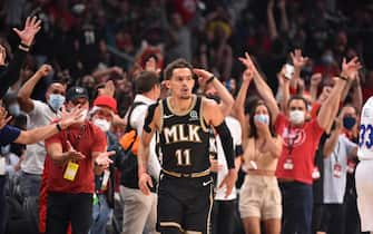 ATLANTA, GA - JUNE 18: Trae Young #11 of the Atlanta Hawks reacts during a game against the Philadelphia 76ers during Round 2, Game 6 of the Eastern Conference Playoffs on June 18, 2021 at State Farm Arena in Atlanta, Georgia. NOTE TO USER: User expressly acknowledges and agrees that, by downloading and/or using this Photograph, user is consenting to the terms and conditions of the Getty Images License Agreement. Mandatory Copyright Notice: Copyright 2021 NBAE (Photo by Jesse D. Garrabrant/NBAE via Getty Images) 