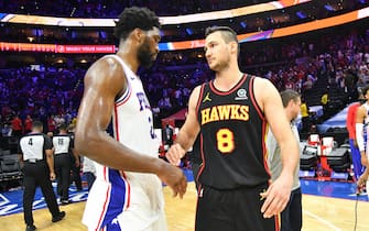 1233569819 PHILADELPHIA, PA - JUNE 20: Ben Simmons #25 of the Philadelphia 76ers and Danilo Gallinari #8 of the Atlanta Hawks high-five after Round 2, Game 7 of the Eastern Conference Playoffs on June 20, 2021 at Wells Fargo Center in Philadelphia, Pennsylvania. NOTE TO USER: User expressly acknowledges and agrees that, by downloading and/or using this Photograph, user is consenting to the terms and conditions of the Getty Images License Agreement. Mandatory Copyright Notice: Copyright 2021 NBAE (Photo by Jesse D. Garrabrant/NBAE via Getty Images)