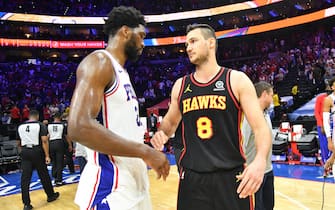 PHILADELPHIA, PA - JUNE 20: Ben Simmons #25 of the Philadelphia 76ers and Danilo Gallinari #8 of the Atlanta Hawks high-five after Round 2, Game 7 of the Eastern Conference Playoffs on June 20, 2021 at Wells Fargo Center in Philadelphia, Pennsylvania. NOTE TO USER: User expressly acknowledges and agrees that, by downloading and/or using this Photograph, user is consenting to the terms and conditions of the Getty Images License Agreement. Mandatory Copyright Notice: Copyright 2021 NBAE (Photo by Jesse D. Garrabrant/NBAE via Getty Images) 