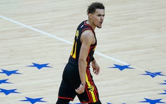 1324620389 PHILADELPHIA, PENNSYLVANIA - JUNE 20: Trae Young #11 of the Atlanta Hawks celebrates during the fourth quarter against the Philadelphia 76ers during Game Seven of the Eastern Conference Semifinals at Wells Fargo Center on June 20, 2021 in Philadelphia, Pennsylvania. NOTE TO USER: User expressly acknowledges and agrees that, by downloading and or using this photograph, User is consenting to the terms and conditions of the Getty Images License Agreement. (Photo by Tim Nwachukwu/Getty Images)