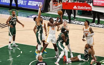 1233622738 MILWAUKEE, WI - JUNE 23: Clint Capela #15 of the Atlanta Hawks shoots the ball during the game against the Milwaukee Bucks during Game 1 of the Eastern Conference Finals of the 2021 NBA Playoffs on June 23, 2021 at the Fiserv Forum Center in Milwaukee, Wisconsin. NOTE TO USER: User expressly acknowledges and agrees that, by downloading and or using this Photograph, user is consenting to the terms and conditions of the Getty Images License Agreement. Mandatory Copyright Notice: Copyright 2021 NBAE (Photo by Kamil Krzaczynski/NBAE via Getty Images).