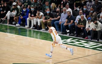 MILWAUKEE, WISCONSIN - JUNE 23: Trae Young #11 of the Atlanta Hawks celebrates a basket against the Milwaukee Bucks during the second quarter in game one of the Eastern Conference Finals at Fiserv Forum on June 23, 2021 in Milwaukee, Wisconsin. (Photo by Patrick McDermott/Getty Images)