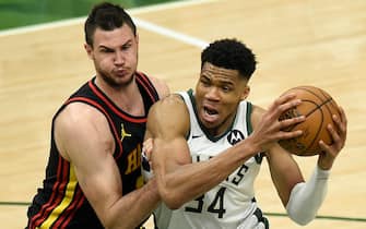 1325503117 MILWAUKEE, WISCONSIN - JUNE 25: Giannis Antetokounmpo #34 of the Milwaukee Bucks is pressured by Danilo Gallinari #8 of the Atlanta Hawks during the first half in game two of the Eastern Conference Finals at Fiserv Forum on June 25, 2021 in Milwaukee, Wisconsin. NOTE TO USER: User expressly acknowledges and agrees that, by downloading and or using this photograph, User is consenting to the terms and conditions of the Getty Images License Agreement. (Photo by Patrick McDermott/Getty Images)