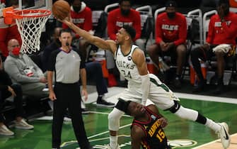 MILWAUKEE, WISCONSIN - JUNE 25: Giannis Antetokounmpo #34 of the Milwaukee Bucks goes up for a shot against Clint Capela #15 of the Atlanta Hawks during the second half in game two of the Eastern Conference Finals at Fiserv Forum on June 25, 2021 in Milwaukee, Wisconsin. NOTE TO USER: User expressly acknowledges and agrees that, by downloading and or using this photograph, User is consenting to the terms and conditions of the Getty Images License Agreement. (Photo by Stacy Revere/Getty Images)