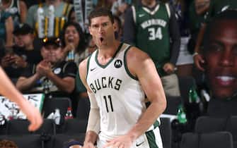 MILWAUKEE, WI - JULY 1: Brook Lopez #11 of the Milwaukee Bucks celebrates during Game 5 of the Eastern Conference Finals of the 2021 NBA Playoffs on July 1, 2021 at the Fiserv Forum Center in Milwaukee, Wisconsin. NOTE TO USER: User expressly acknowledges and agrees that, by downloading and or using this Photograph, user is consenting to the terms and conditions of the Getty Images License Agreement. Mandatory Copyright Notice: Copyright 2021 NBAE (Photo by Gary Dineen/NBAE via Getty Images).