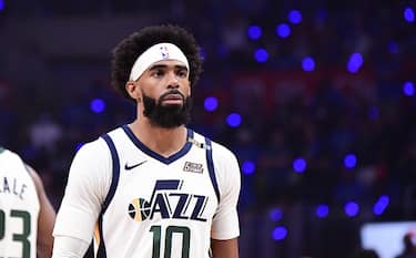 LOS ANGELES, CA - JUNE 18: Mike Conley #10 of the Utah Jazz looks on before the game against the LA Clippers during Round 2, Game 6 of the 2021 NBA Playoffs on June 18, 2021 at STAPLES Center in Los Angeles, California. NOTE TO USER: User expressly acknowledges and agrees that, by downloading and/or using this Photograph, user is consenting to the terms and conditions of the Getty Images License Agreement. Mandatory Copyright Notice: Copyright 2021 NBAE (Photo by Adam Pantozzi/NBAE via Getty Images)
