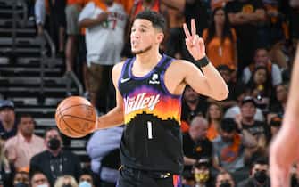 1233880833 PHOENIX, AZ - JULY 8: Devin Booker #1 of the Phoenix Suns sets the play during the game against the Milwaukee Bucks during Game Two of the 2021 NBA Finals on July 8, 2021 at Phoenix Suns Arena in Phoenix, Arizona. NOTE TO USER: User expressly acknowledges and agrees that, by downloading and or using this photograph, user is consenting to the terms and conditions of the Getty Images License Agreement. Mandatory Copyright Notice: Copyright 2021 NBAE (Photo by Andrew D. Bernstein/NBAE via Getty Images)