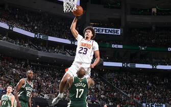 MILWAUKEE, WI - JULY 11: Cameron Johnson #23 of the Phoenix Suns dunks the ball against the Milwaukee Bucks during Game Three of the 2021 NBA Finals on July 11, 2021 at the Fiserv Forum Center in Milwaukee, Wisconsin. NOTE TO USER: User expressly acknowledges and agrees that, by downloading and or using this Photograph, user is consenting to the terms and conditions of the Getty Images License Agreement. Mandatory Copyright Notice: Copyright 2021 NBAE (Photo by Nathaniel S. Butler/NBAE via Getty Images).