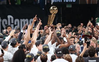 MILWAUKEE, WI - JULY 20: The Milwaukee Bucks hold the Larry O'Brien Trophy after winning Game Six of the 2021 NBA Finals on July 20, 2021 at the Fiserv Forum in Milwaukee, Wisconsin. NOTE TO USER: User expressly acknowledges and agrees that, by downloading and or using this Photograph, user is consenting to the terms and conditions of the Getty Images License Agreement. Mandatory Copyright Notice: Copyright 2021 NBAE (Photo by David Sherman/NBAE via Getty Images).