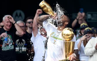 MILWAUKEE, WISCONSIN - JULY 22: P.J. Tucker celebrates with the Larry O'Brien trophy during the Milwaukee Bucks 2021 NBA Championship Victory Parade and Rally in the Deer District of Fiserv Forum on July 22, 2021 in Milwaukee, Wisconsin. NOTE TO USER: User expressly acknowledges and agrees that, by downloading and or using this photograph, User is consenting to the terms and conditions of the Getty Images License Agreement. (Photo by Patrick McDermott/Getty Images)