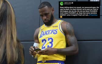 LeBron James checks his cellphone on arrival for his press conference on the Los Angeles Lakers in Los Angeles, California, September 24, 2018, with the Lakers' newest blockbuster signing and teammates met with the media. - The Lakers open their 2018 NBA season in Portland on October 18th. (Photo by Frederic J. BROWN / AFP)        (Photo credit should read FREDERIC J. BROWN/AFP via Getty Images)