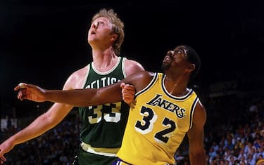 INGLEWOOD, CA - 1984: Magic Johnson #32 of the Los Angeles Lakers battles for position against Larry Bird #33 of the Boston Celtics during a game in 1984 at The Great Western Forum in Inglewood, California.  NOTE TO USER: User expressly acknowledges and agrees that, by downloading and/or using this Photograph, user is consenting to the terms and conditions of the Getty Images License Agreement. Mandatory Copyright Notice: Copyright 1984 NBAE (Photo by Andrew D. Bernstein/NBAE via Getty Images)