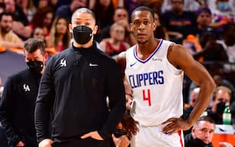 PHOENIX, AZ - JUNE 20: Head Coach Tyronn Lue and Rajon Rondo #4 of the LA Clippers look on during the game against the Phoenix Suns during Game 1 of the Western Conference Finals of the 2021 NBA Playoffs on June 20, 2021 at Phoenix Suns Arena in Phoenix, Arizona. NOTE TO USER: User expressly acknowledges and agrees that, by downloading and or using this photograph, user is consenting to the terms and conditions of the Getty Images License Agreement. Mandatory Copyright Notice: Copyright 2021 NBAE (Photo by Barry Gossage/NBAE via Getty Images)