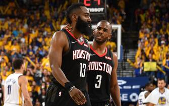 OAKLAND, CA - APRIL 28: James Harden #13, and Chris Paul #3 of the Houston Rockets talk against the Golden State Warriors during the Western Conference Semifinals of the NBA Playoffs on April 28, 2019 at ORACLE Arena in Oakland, California. NOTE TO USER: User expressly acknowledges and agrees that, by downloading and or using this photograph, user is consenting to the terms and conditions of Getty Images License Agreement. Mandatory Copyright Notice: Copyright 2019 NBAE (Photo by Andrew D. Bernstein/NBAE via Getty Images)