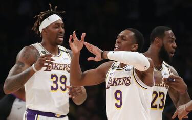 LOS ANGELES, CALIFORNIA - FEBRUARY 23: Dwight Howard #39, Rajon Rondo #9, Kentavious Caldwell-Pope #1 and LeBron James #23 of the Los Angeles Lakers reacts to a play during the game against the Boston Celtics at Staples Center on February 23, 2020 in Los Angeles, California. (Photo by Katelyn Mulcahy/Getty Images)