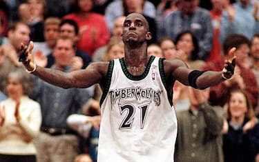 MINNEAPOLIS, UNITED STATES:  Minnesota Timberwolves' Kevin Garnett ralleys the crowd in the final seconds of of the fourth quarter as the Wolves came back to tie the Seattle SuperSonics and go into overtime, 04 March, 2001, at Target Center, in Minneapolis, Minnesota. The Timberwolves won 119-111 in overtime.   (FILM)    AFP   PHOTO/Craig LASSIG (Photo credit should read CRAIG LASSIG/AFP via Getty Images)