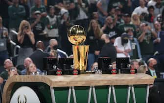 MILWAUKEE, WI - OCTOBER 19: A detail shot of the 2021 NBA Championship Trophy and rings for the Milwaukee Bucks before the game against the Brooklyn Nets on October 19, 2021 at the Fiserv Forum Center in Milwaukee, Wisconsin. NOTE TO USER: User expressly acknowledges and agrees that, by downloading and or using this Photograph, user is consenting to the terms and conditions of the Getty Images License Agreement. Mandatory Copyright Notice: Copyright 2021 NBAE (Photo by Gary Dineen/NBAE via Getty Images). 