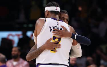 LOS ANGELES, CALIFORNIA - OCTOBER 24: Ja Morant #12 of the Memphis Grizzlies congratulates Carmelo Anthony #7 of the Los Angeles Lakers after a 121-118 Lakers win at Staples Center on October 24, 2021 in Los Angeles, California. (Photo by Harry How/Getty Images)