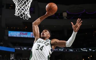MILWAUKEE, WI - OCTOBER 27: Giannis Antetokounmpo #34 of the Milwaukee Bucks dunks during the NBA game against the Minnesota Timberwolves at Fiserv Forum on October 27, 2021 in Milwaukee, Wisconsin. NOTE TO USER: User expressly acknowledges and agrees that, by downloading and/or using this photograph, user is consenting to the terms and conditions of the Getty Images License Agreement.  Mandatory Copyright Notice: Copyright 2021 NBAE (Photo by Gary Dineen/NBAE via Getty Images)