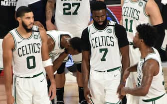 ORLANDO, FL - AUGUST 21: Jayson Tatum, Jaylen Brown #7 and Marcus Smart of the Boston Celtics chats against the Philadelphia 76ers for Game three of the first round of the 2020 Playoffs as part of the NBA Restart 2020 on August 21, 2020 at The Field House in Orlando, Florida. NOTE TO USER: User expressly acknowledges and agrees that, by downloading and/or using this photograph, user is consenting to the terms and conditions of the Getty Images License Agreement.  Mandatory Copyright Notice: Copyright 2020 NBAE (Photo by David Dow/NBAE via Getty Images)