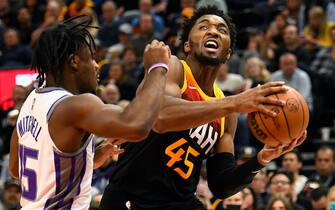 SALT LAKE CITY, UTAH - NOVEMBER 02: Donovan Mitchell #45 of the Utah Jazz drives into Davion Mitchell #15 of the Sacramento Kings during a game at Vivint Smart Home Arena on November 02, 2021 in Salt Lake City, Utah. NOTE TO USER: User expressly acknowledges and agrees that, by downloading and or using this photograph, User is consenting to the terms and conditions of the Getty Images License Agreement. (Photo by Alex Goodlett/Getty Images)