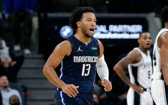SAN ANTONIO, TX - NOVEMBER  3:  Jalen Brunson #13 of the Dallas Mavericks reacts after scoring against the San Antonio Spurs during second-half action at AT&T Center on November 3, 2021 in San Antonio, Texas.  NOTE TO USER: User expressly acknowledges and agrees that , by downloading and or using this photograph, User is consenting to the terms and conditions of the Getty Images License Agreement. (Photo by Ronald Cortes/Getty Images)