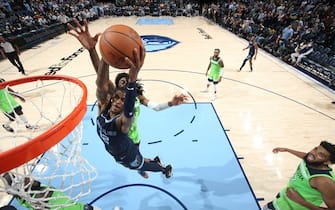 MEMPHIS, TN - NOVEMBER 8: Ja Morant #12 of the Memphis Grizzlies shoots the ball against the Minnesota Timberwolves on November 8, 2021 at FedExForum in Memphis, Tennessee. NOTE TO USER: User expressly acknowledges and agrees that, by downloading and or using this photograph, User is consenting to the terms and conditions of the Getty Images License Agreement. Mandatory Copyright Notice: Copyright 2021 NBAE (Photo by Joe Murphy/NBAE via Getty Images)