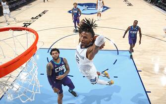 MEMPHIS, TN - NOVEMBER 10: Ja Morant #12 of the Memphis Grizzlies dunks the ball against the Charlotte Hornets on November 10, 2021 at FedExForum in Memphis, Tennessee. NOTE TO USER: User expressly acknowledges and agrees that, by downloading and or using this photograph, User is consenting to the terms and conditions of the Getty Images License Agreement. Mandatory Copyright Notice: Copyright 2021 NBAE (Photo by Joe Murphy/NBAE via Getty Images)