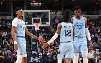 MEMPHIS, TN - NOVEMBER 12: Ja Morant #12, Ziaire Williams #8, and Jaren Jackson Jr. #13 of the Memphis Grizzlies celebrate during a game against the Phoenix Suns on November 12, 2021 at FedExForum in Memphis, Tennessee. NOTE TO USER: User expressly acknowledges and agrees that, by downloading and or using this photograph, User is consenting to the terms and conditions of the Getty Images License Agreement. Mandatory Copyright Notice: Copyright 2021 NBAE (Photo by Joe Murphy/NBAE via Getty Images)